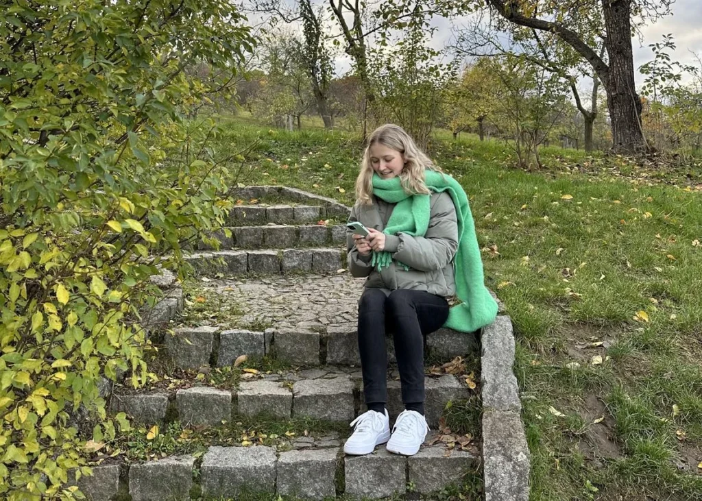 Social Media Manager looking at their phone